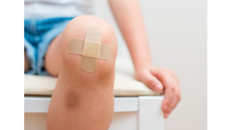 Image of a person with a band-aid on their knee