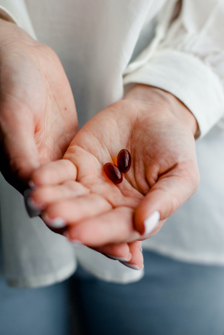 Image of hands holding medicines